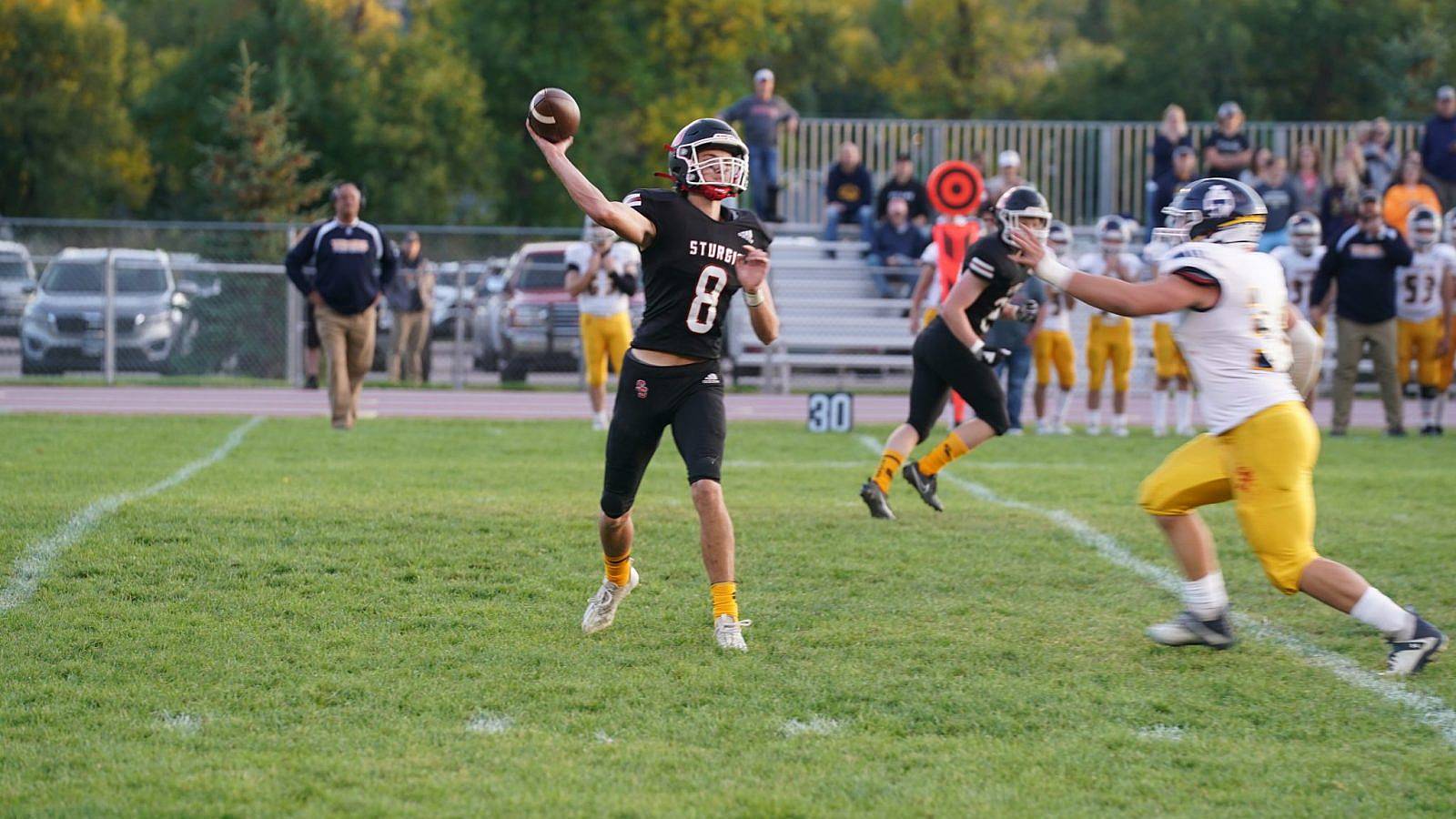 Scooper quarterback Aiden Hedderman looks to pass against Tea Area on Friday night at Woodle Field.