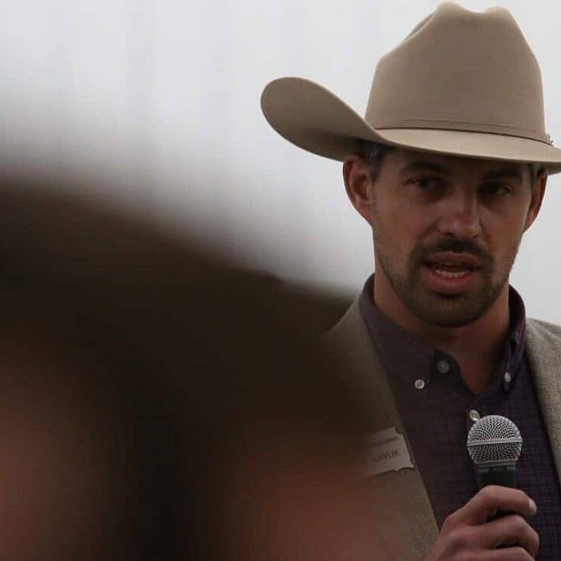 Rancher using a microphone at meeting