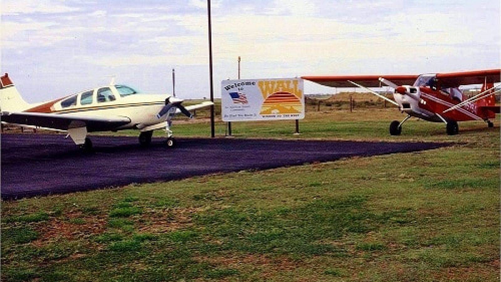 airplanes on runway at Wall, SD municipal airport