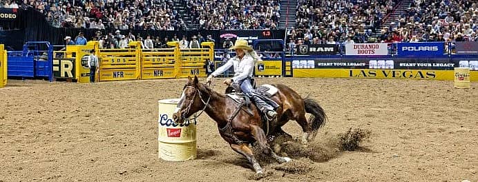 south dakota cowgirl on horse at national finals rodeo