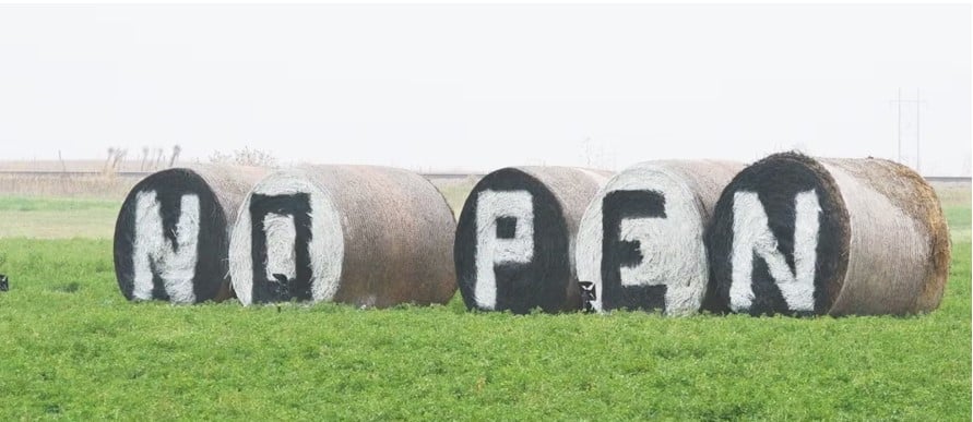 bales of hay in field location of penitentiary South Dakota lawsuit