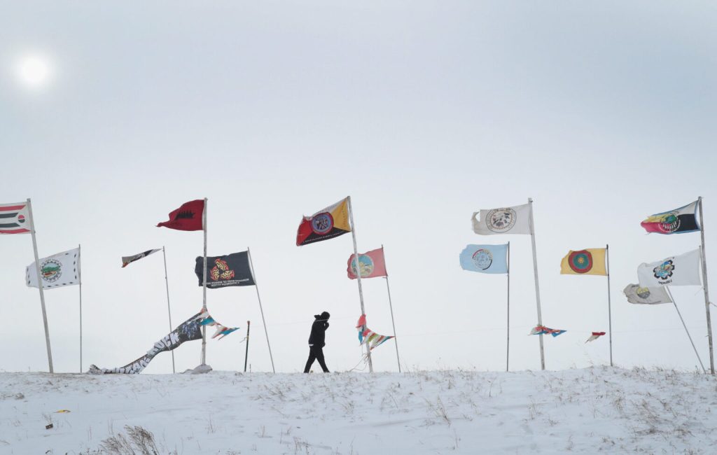 U.S. Native American tribal flags on display.