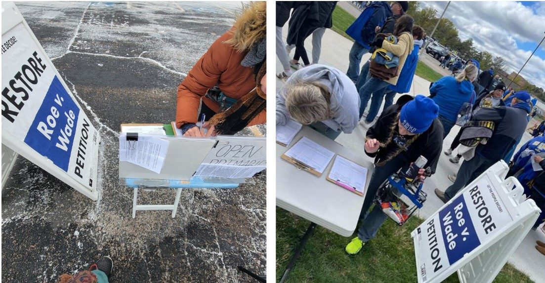 People signing a ballot petition