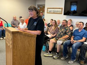 Citizens speaking at city council meeting