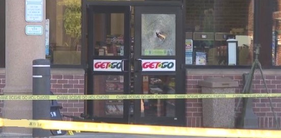 Police tape surrounds a convenience store