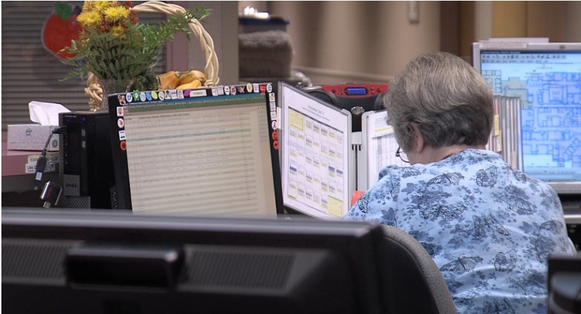 Nurses at a nursing station in a long-term care facility.