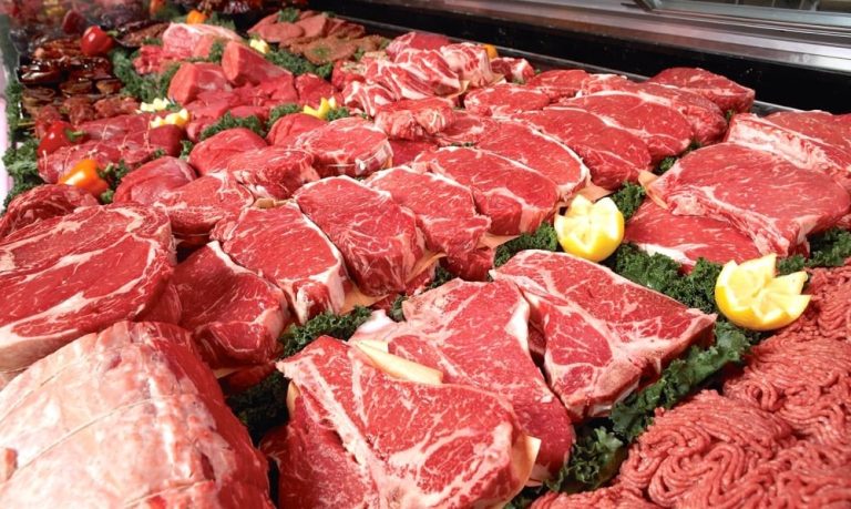 A supermarket meat case filled with fresh beef