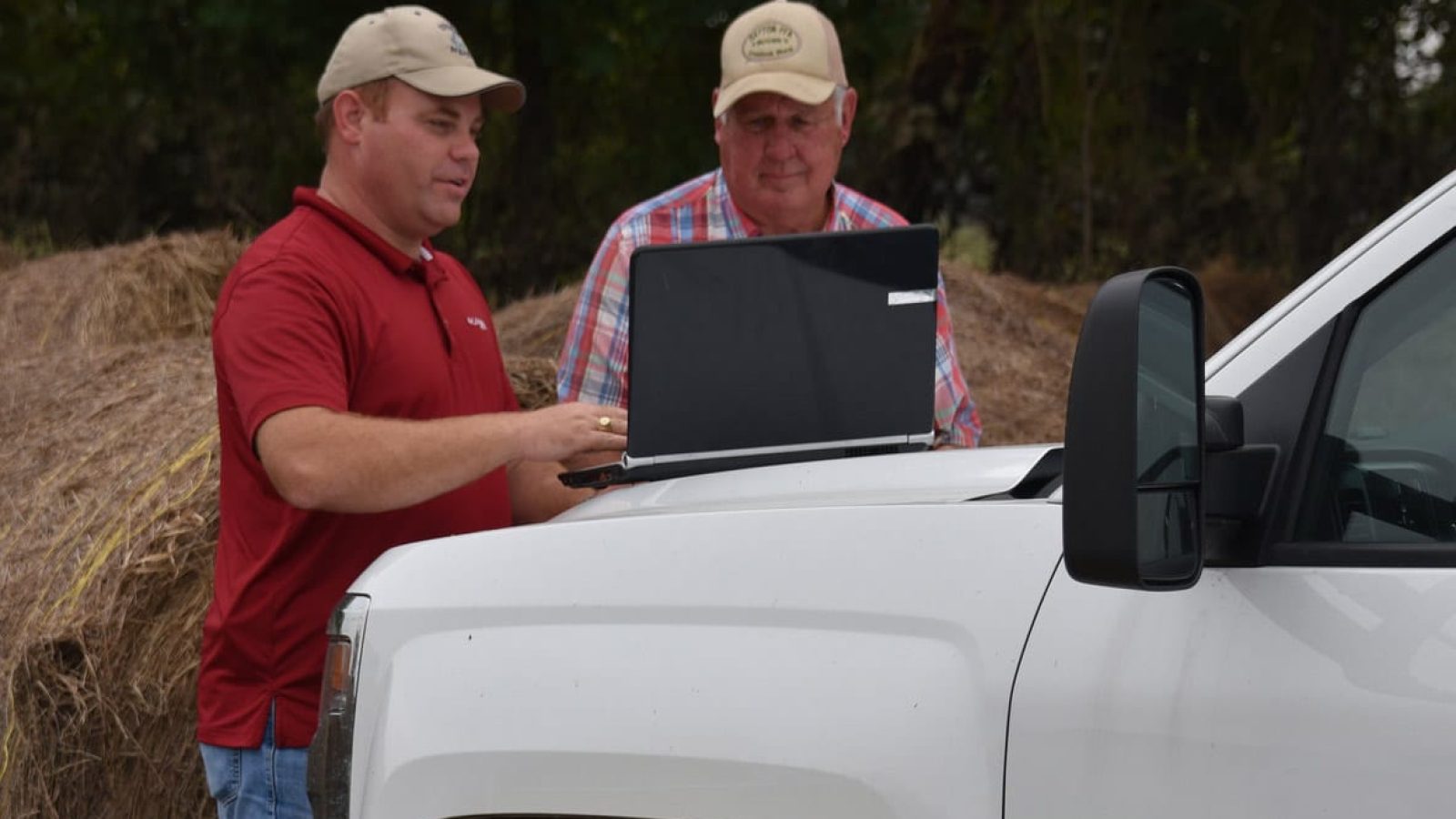 Ranchers with computer